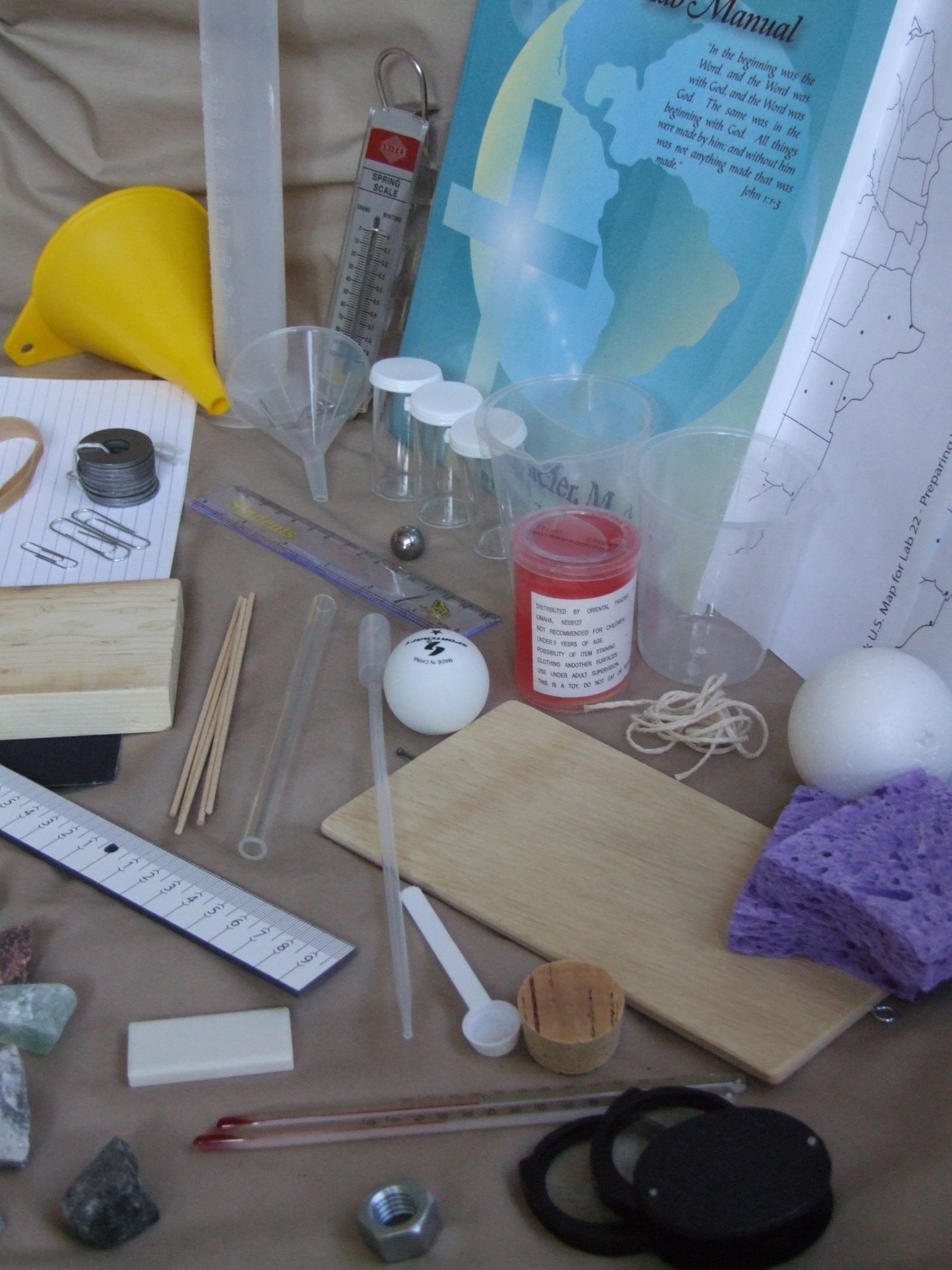 Beakers, funnel, minerals and lenses used in the mineral and optics labs