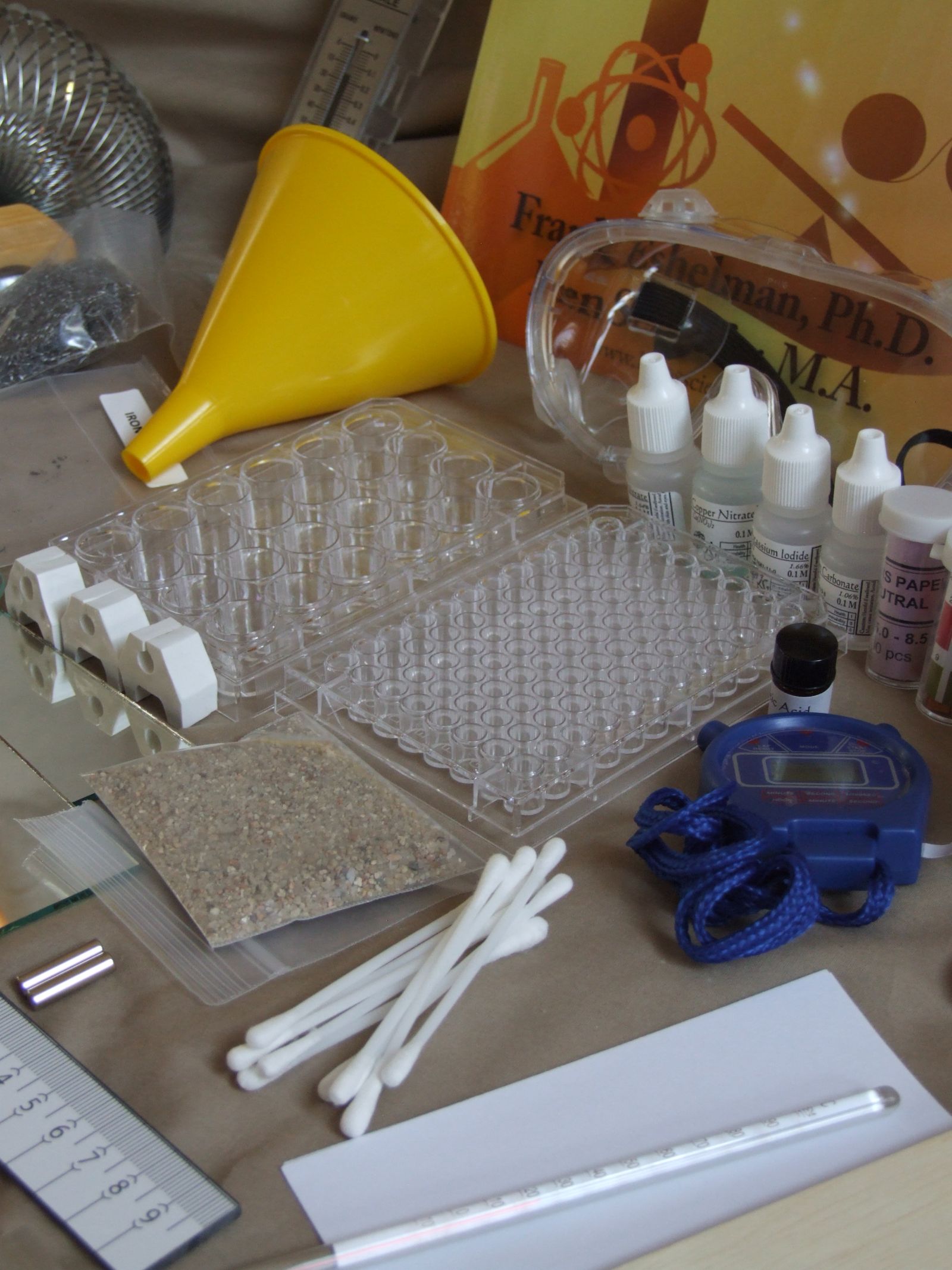 Well plates, funnel, reagent bottles and pH test strips