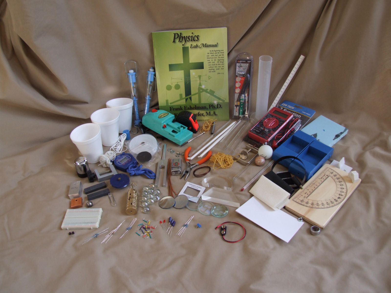 Every item in the Physics Kit laid out: manual, meters, optics, timer and components